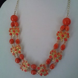 Double Strand of Coral Ceramic Beads Surrounding Coral and Gold Enamel Charms and Salmon Swarovski Crystals