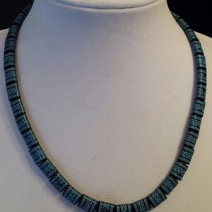 Mens native decorated beaded necklace with blue and black native designed beads, black leather cording, silver lobster claw clasp