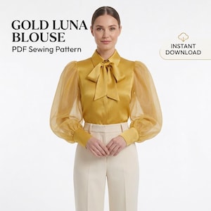 May include: A gold blouse with long sheer puff sleeves, a pointed collar, and a neck tie. The text reads GOLD LUNA BLOUSE PDF Sewing Pattern and INSTANT DOWNLOAD. The blouse is paired with cream-colored trousers.