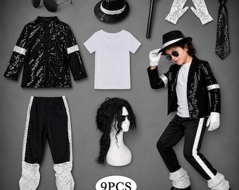 May include: A 9-piece costume set including a black sequined jacket with silver bands, black pants with silver cuffs, a white V-neck shirt, a black fedora, aviator sunglasses, a silver microphone, white sequined gloves, and a black tie.