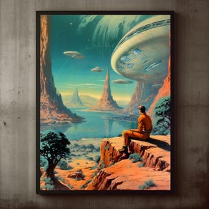 May include: A framed wall art print depicting a science fiction landscape with a person in an orange jumpsuit sitting on a rocky cliff overlooking a blue lake, tall spires, and several large, metallic flying saucers in a teal sky.