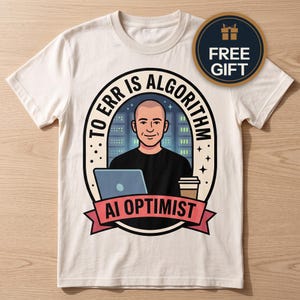 May include: A cream-colored t-shirt featuring a graphic of a person in a black shirt sitting at a laptop with a coffee cup. The design includes the text "TO ERR IS ALGORITHM" and "AI OPTIMIST" inside an oval frame with a server room background.