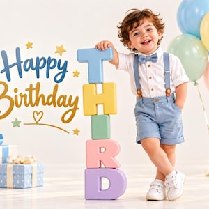 May include: A child wearing a white button-down shirt, a blue bowtie, blue suspenders, and blue shorts, standing next to a vertical stack of pastel-colored blocks spelling the word THIRD. The text Happy Birthday is displayed in blue and gold.