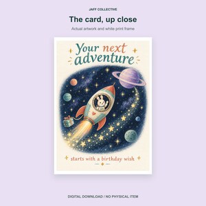 May include: A greeting card featuring a space scene with a rocket ship piloted by a rabbit. The text reads Your next adventure starts with a birthday wish. The rocket has a trail of stars, planets, and a gift box against a dark blue background.