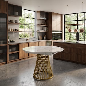 May include: A round dining table featuring a white marble top with grey veining, supported by a conical base constructed from thin, vertical gold-toned metal rods arranged in a crisscross pattern, positioned in a kitchen with wood cabinetry.