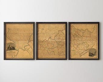 May include: Three framed vintage-style maps of Kentucky displayed side-by-side. Each rectangular print features a sepia-toned, aged paper appearance with detailed black line work depicting geographical borders, rivers, and terrain, all encased in dark frames.