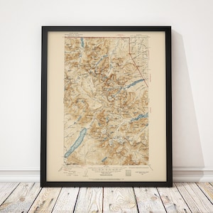 May include: A vintage map of the Great Mountain, New York, printed in brown, blue, and black ink. The map shows the topography of the area with contour lines and labels for mountains, lakes, and rivers.