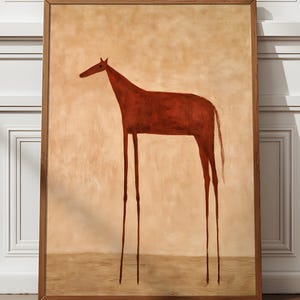 May include: A framed wall art print featuring a stylized, long-legged horse painted in a deep reddish-brown hue. The horse is positioned against a solid, light beige background, with a darker tan horizontal band representing the ground.