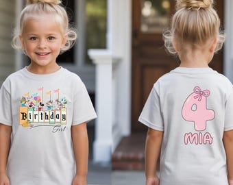 May include: A light gray t-shirt featuring a front graphic of cartoon characters with the text Birthday Girl and a back graphic of a large pink number 4 with a bow and the name MIA printed in pink lettering below the number.