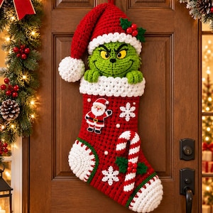May include: A red and white crocheted Christmas stocking featuring a green Grinch character wearing a Santa hat at the top. The stocking is decorated with a Santa Claus applique, white snowflakes, and a red and white striped candy cane.