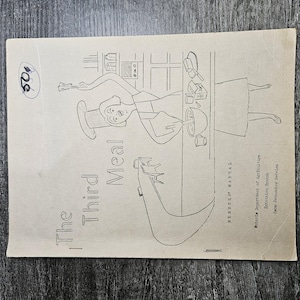 May include: A vintage paper manual titled The Third Meal, Member's Manual, Ontario Department of Agriculture, Extension Branch, Home Economics Service. The cover features a black line drawing of a person cooking in a kitchen with a 50 cent mark.
