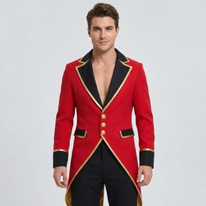 May include: A red tailcoat jacket featuring black lapels, black cuffs, and gold trim. The jacket has three gold buttons down the front and two horizontal pockets with black flaps and gold piping. The design includes a deep V-neckline and long sleeves.