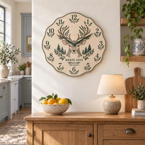 May include: A scalloped-edge wall clock with a light wood finish featuring a central deer head illustration, dark green pine trees, and the text MERRY DAYS THE KENTS. The clock has dark green hands and black numerals from one to twelve.