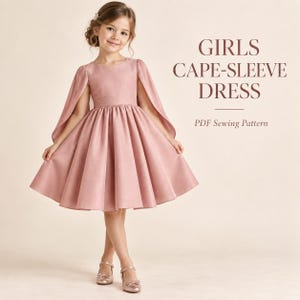 May include: A dusty rose-coloured dress with cape-style sleeves and a full, pleated skirt. The text GIRLS CAPE-SLEEVE DRESS PDF Sewing Pattern is printed on the right side. The garment features a round neckline and a fitted waistline.