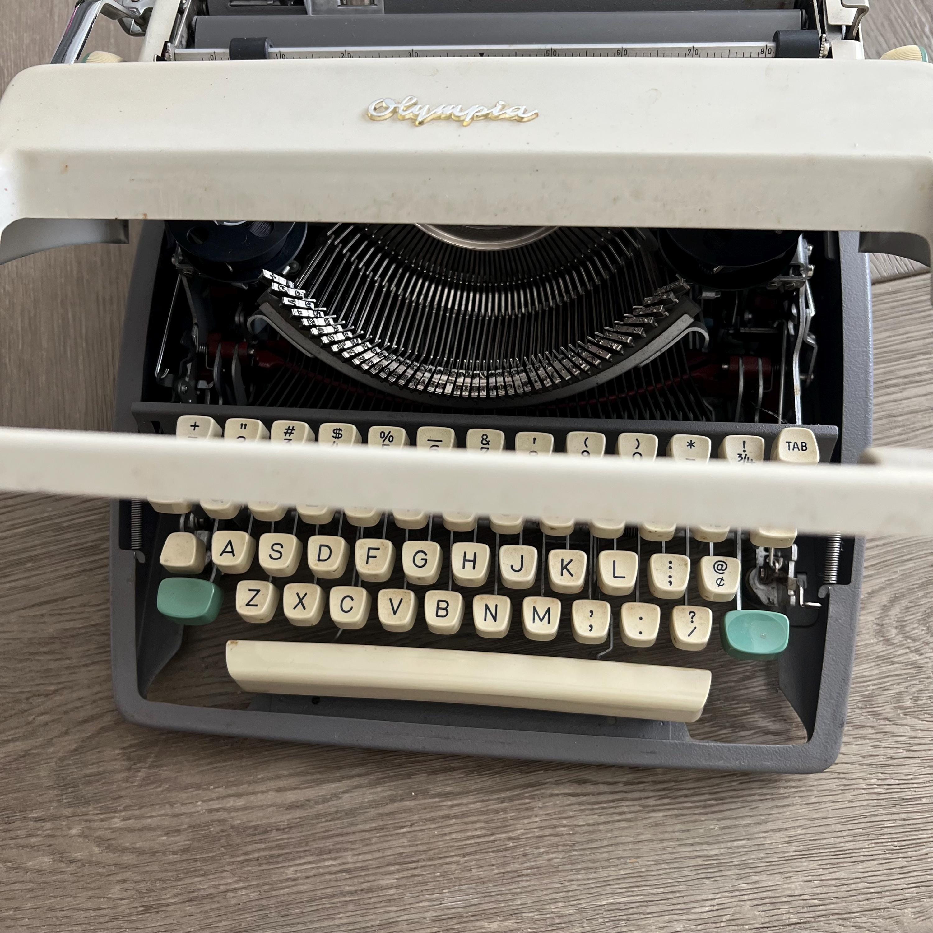Vintage Olympia Portable Typewriter: West Germany, QWERTY, With