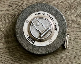 Cinta métrica Lufkin de la década de 1950: acero blanco, retráctil, 50 pies