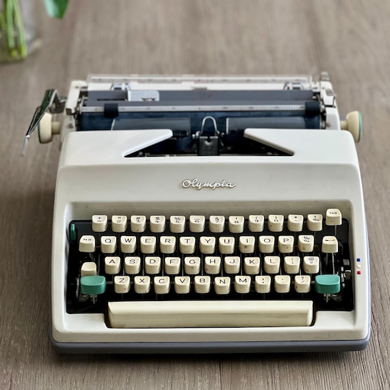 Vintage Olympia Portable Typewriter: West Germany, QWERTY, With