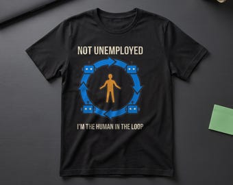 May include: A black t-shirt featuring a graphic with the text NOT UNEMPLOYED and I'M THE HUMAN IN THE LOOP. The design includes a central orange human figure surrounded by a blue circular arrow containing four small blue robot icons.