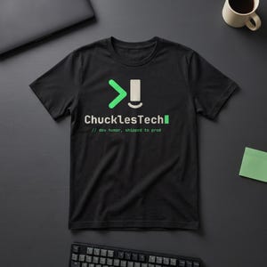 May include: A black short-sleeved t-shirt featuring a graphic with a green greater-than symbol, a white vertical bar, and the text ChucklesTech followed by a green square. Below, the text reads // dev humor, shipped to prod.