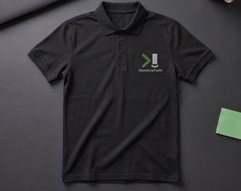 May include: A black short-sleeved polo shirt with a collar and a three-button placket. The left chest features a logo with a green chevron, a white rectangle, and the text "ChucklesTech" printed in white and green lettering.