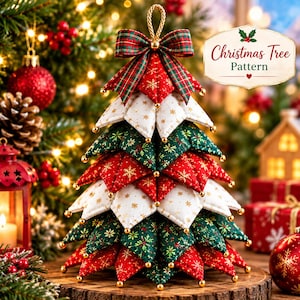 May include: A fabric Christmas tree ornament featuring layered, quilted triangular segments in red, white, and green with gold snowflake patterns. The top is adorned with a plaid bow and a gold hanging loop. Text reads Christmas Tree Pattern.