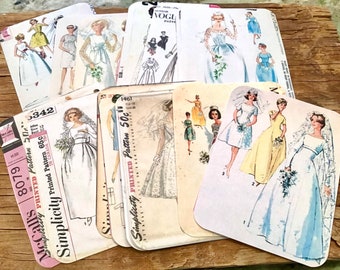 May include: Vintage wedding dress sewing patterns, including McCall's 8079 and Simplicity patterns 650 and 1461. The patterns feature various styles of wedding dresses with lace, tulle, and satin.