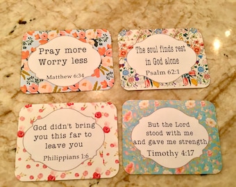 May include: Four floral patterned cards with inspirational quotes and bible verses. The quotes are: "Pray more Worry less Matthew 6:34", "The soul finds rest in God alone Psalm 62:1", "God didn't bring you this far to leave you Philippians 1:6", and "But the Lord stood with me and gave me strength Timothy 4:17".