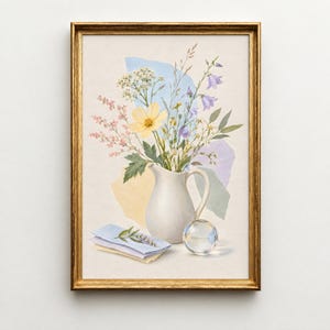 May include: A framed wall art print featuring a white ceramic pitcher filled with a bouquet of wildflowers, including yellow cosmos and blue bellflowers. Behind the pitcher are abstract paper shapes in blue, yellow, and purple, with a glass sphere.