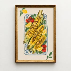 May include: A framed wall art print featuring a rectangular blue and white patterned platter filled with three grilled corn cobs, red cherry tomatoes, lemon wedges, and green parsley sprigs, with an additional lemon and leaves nearby.