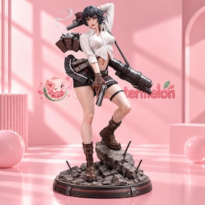 May include: A detailed collectible figurine of a character with short black hair, wearing a white button-down shirt, a black pleated skirt, and brown combat boots. The figure holds a handgun and carries a large black cannon, standing on a rocky base.