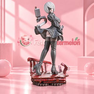 May include: A collectible figurine of a character with short white hair and a black blindfold, wearing a black dress with intricate embroidery and high-heeled boots. The figure stands on a weathered, dark red platform with mechanical details.