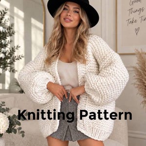 May include: A chunky, off-white, open-front knit cardigan with long, voluminous sleeves and a textured stitch pattern. The garment is worn over a light-colored top and a black and white patterned skirt. The text Knitting Pattern is visible.