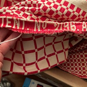 May include: Red and white checkered fabric with a red woven label that reads "PATENT. NO. 7196 A.D."