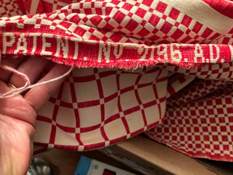 May include: Red and white checkered fabric with a red woven label that reads "PATENT. NO. 7196 A.D."