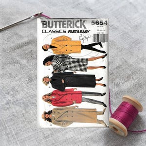May include: A Butterick Classics 5654 sewing pattern envelope featuring illustrations of five double-breasted coats in yellow, black and white houndstooth, black, red, and tan. The text includes the brand name, pattern number, and size 20-22-24.