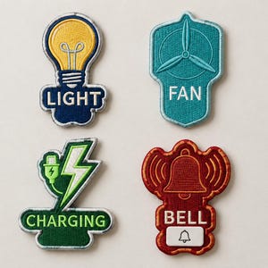 May include: Four embroidered patches featuring icons and text. Top left: yellow lightbulb with the word LIGHT. Top right: teal fan with the word FAN. Bottom left: green lightning bolt and plug with the word CHARGING. Bottom right: red bell with the word BELL.