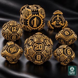 May include: A set of seven polyhedral dice featuring a metallic gold finish with black recessed details. Each die is intricately decorated with raised gear and cog motifs. The text Pure Dice is visible in the bottom right corner.