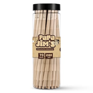 May include: A clear plastic cylindrical container filled with 240 unbleached pre-rolled cones. The label features the text Papa Jim's, Unbleached Pre-Rolled Cones, 70 MM SIZE, and 240 CONES, along with a cartoon illustration of a person.