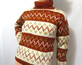 May include: A brown, white, and gold patterned turtleneck sweater. The sweater has a geometric design with a high neckline.