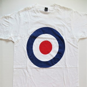 May include: White t-shirt with a large blue, white, and red target design.