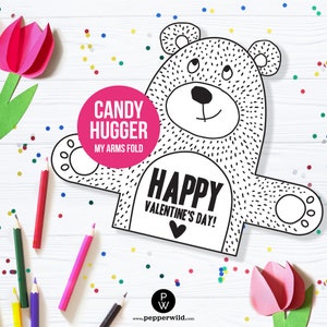 May include: A printable coloring page featuring a bear shaped candy hugger. The bear has a happy expression and says "Happy Valentine's Day!" The text "Candy Hugger My Arms Fold" is also included.