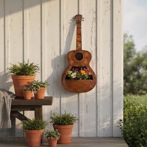 May include: A wall-mounted guitar-shaped metal planter with a rusted brown finish. The hollow body of the guitar serves as a container for a variety of small, colorful flowers including white, yellow, and pink blossoms.