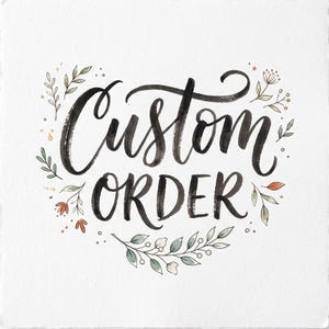 May include: A square white card featuring the black hand-lettered text Custom Order in a brush script style. The text is surrounded by delicate watercolour illustrations of green leaves, small berries, and tiny orange flowers on the sides.
