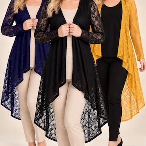 May include: Three long-sleeved lace cardigans in navy blue, black, and mustard yellow. Each cardigan features an open front, a high-low hemline with a pointed back, and intricate floral lace patterns. The garments are worn over solid-colored tops and pants.