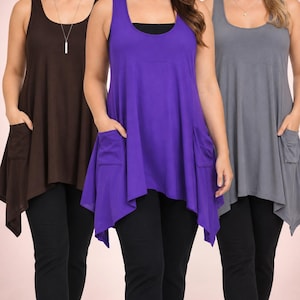 May include: Three sleeveless tunic tops in brown, purple, and gray, each featuring a scoop neckline, a relaxed flared silhouette, and two front patch pockets. The tunics are paired with black leggings. A small circular logo is in the top right corner.