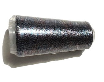 May include: A spool of dark gray thread with a metallic sheen, wrapped in clear plastic. The thread appears to be tightly wound, with a slight texture visible. The spool is set against a white background.