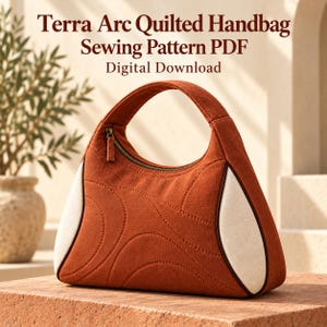 May include: A terracotta-colored quilted handbag with a curved top handle and a zipper closure. The bag features cream-colored side panels and curved stitching patterns. Text reads: Terra Arc Quilted Handbag Sewing Pattern PDF Digital Download.