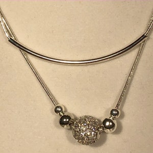 0075 Silver plated two piece necklaces with silver plated round beads and tube beads.  Has a decorative pave ball.