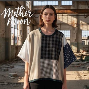 May include: A short-sleeved patchwork shirt featuring a mix of solid beige, white, black and white plaid, brown and white gingham, and navy blue with white polka dots. The text Mother Moon is printed in white script in the upper left corner.