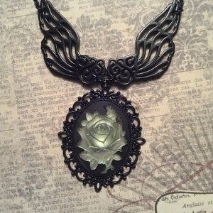 Ornate Iridescent Resin Green Rose Cameo Style Pendant with Black Patina Finish and Open Work Wing Connectors on Necklace